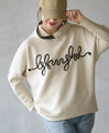 A playful 3D logo. A new hooded dolman top that feels great against your bare skin (beige)