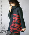 Wrapped in a cozy knit, this top features an eye-catching artistic pattern all around. 