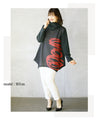 Wrapped in a cozy knit, this top features an eye-catching artistic pattern all around. 