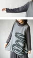 Wrapped in a cozy knit, this top features an eye-catching artistic pattern all around (gray)
