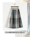 A voluminous tuck skirt with a striking large check pattern