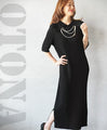 A modern, beautiful knit dress with a large collar in black