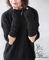 Various arrangements of knitwear with arm warmers