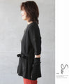 Various arrangements of knitwear with arm warmers