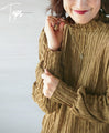 A bottle neck top with a wavy fabric that will make you fall in love at first sight