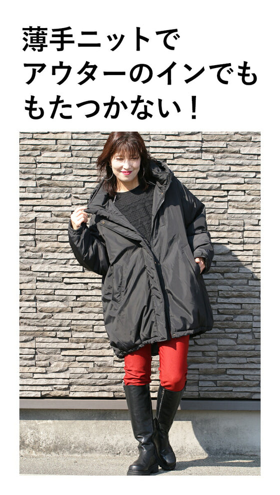 A knit top with a subtle piping logo and a raised fabric