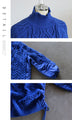A warm combination of different materials. Royal blue stands out against the cold sky.