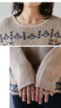 A knit top with a motif pattern that stands out naturally
