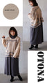 A knit top with a motif pattern that stands out naturally