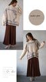 A knit top with a motif pattern that stands out naturally