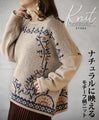 A knit top with a motif pattern that stands out naturally