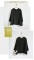 A modified blouse with a flowing hem that catches your eye