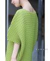 A loose, bouncy zigzag pleated pullover top