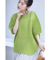 A loose, bouncy zigzag pleated pullover top