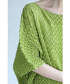 A loose, bouncy zigzag pleated pullover top