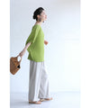 A loose, bouncy zigzag pleated pullover top