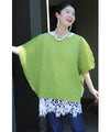A loose, bouncy zigzag pleated pullover top