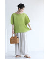 A loose, bouncy zigzag pleated pullover top