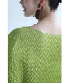 A loose, bouncy zigzag pleated pullover top