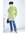 A loose, bouncy zigzag pleated pullover top