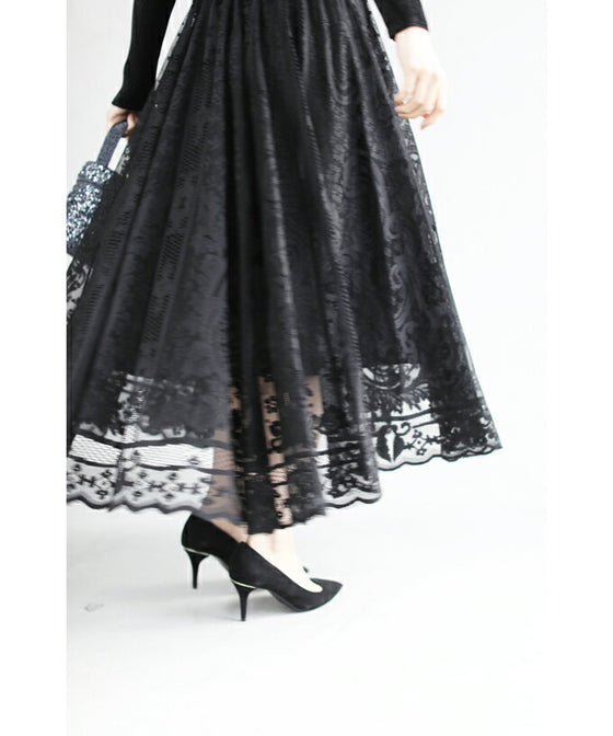 A luxurious, generous lace cache-coeur long dress