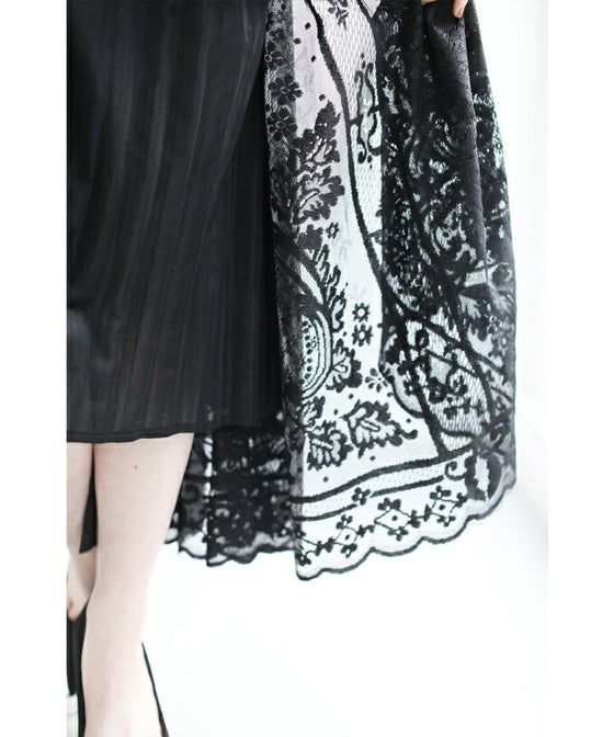 A luxurious, generous lace cache-coeur long dress