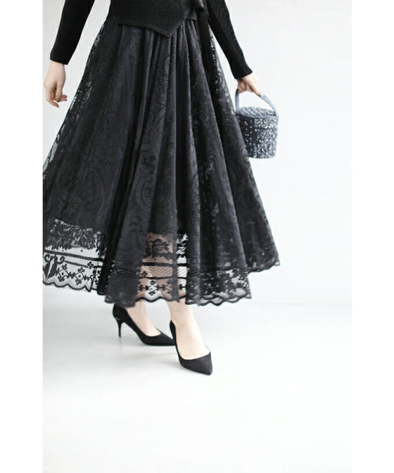 A luxurious, generous lace cache-coeur long dress