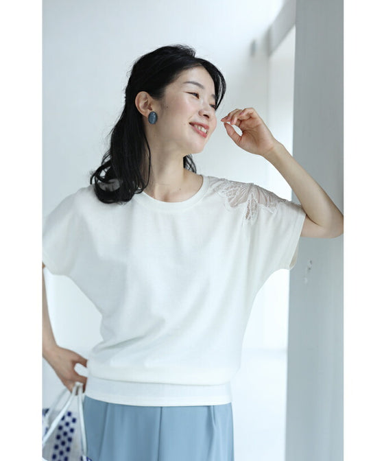A cut-and-sew top with shimmering beads and light drops