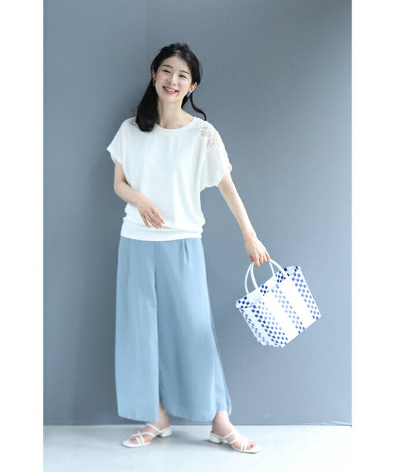 A cut-and-sew top with shimmering beads and light drops