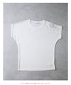A cut-and-sew top with shimmering beads and light drops