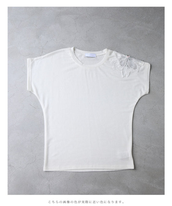 A cut-and-sew top with shimmering beads and light drops