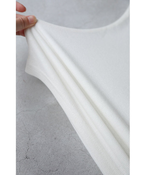 A cut-and-sew top with shimmering beads and light drops