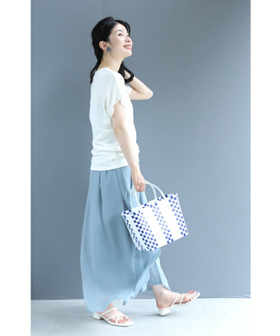 A cut-and-sew top with shimmering beads and light drops