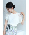 A cut-and-sew top with shimmering beads and light drops