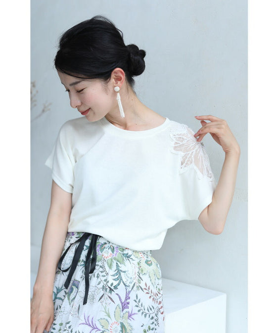 A cut-and-sew top with shimmering beads and light drops