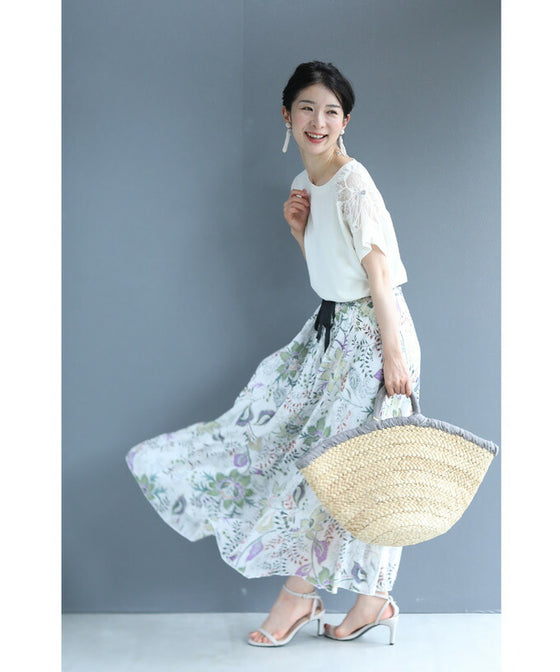A cut-and-sew top with shimmering beads and light drops