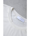 A cut-and-sew top with shimmering beads and light drops