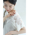 A cut-and-sew top with shimmering beads and light drops