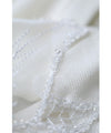 A cut-and-sew top with shimmering beads and light drops