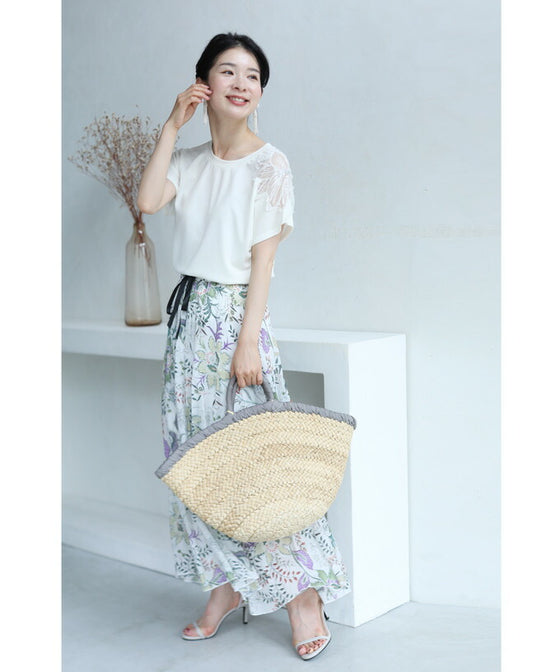 A cut-and-sew top with shimmering beads and light drops