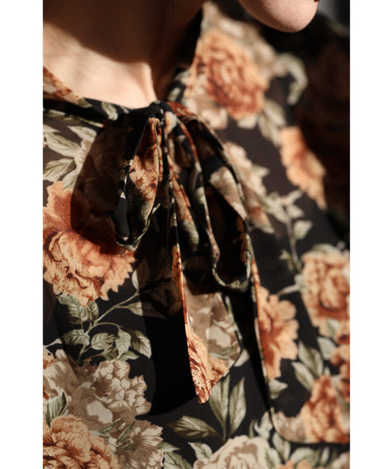 Elegant ribbon-tie blouse top with soft sleeves