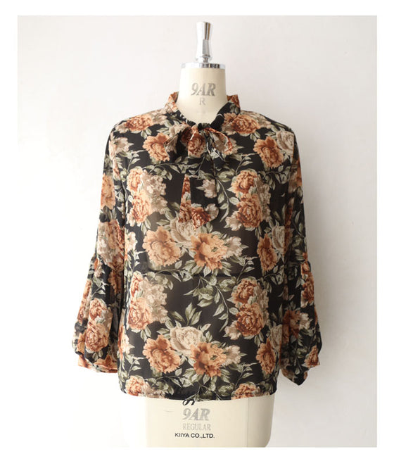 Elegant ribbon-tie blouse top with soft sleeves