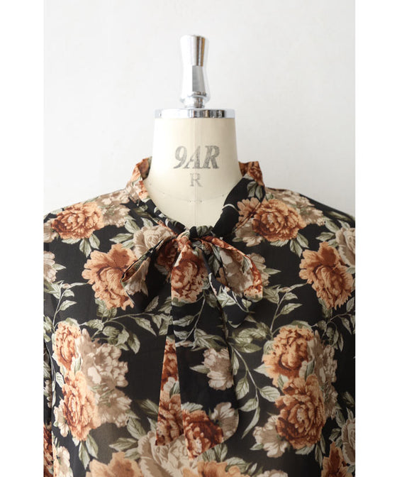 Elegant ribbon-tie blouse top with soft sleeves