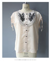 Glossy blouse top with graffiti floral embroidery on organza
