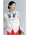 Glossy blouse top with graffiti floral embroidery on organza