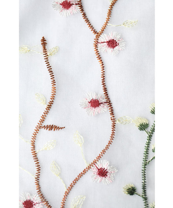 Asymmetrical blouse top with floral embroidery on tulle