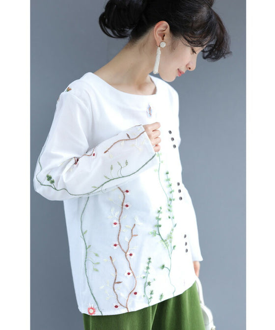 Asymmetrical blouse top with floral embroidery on tulle