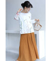 Asymmetrical blouse top with floral embroidery on tulle