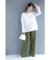 Asymmetrical blouse top with floral embroidery on tulle