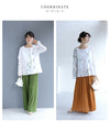 Asymmetrical blouse top with floral embroidery on tulle